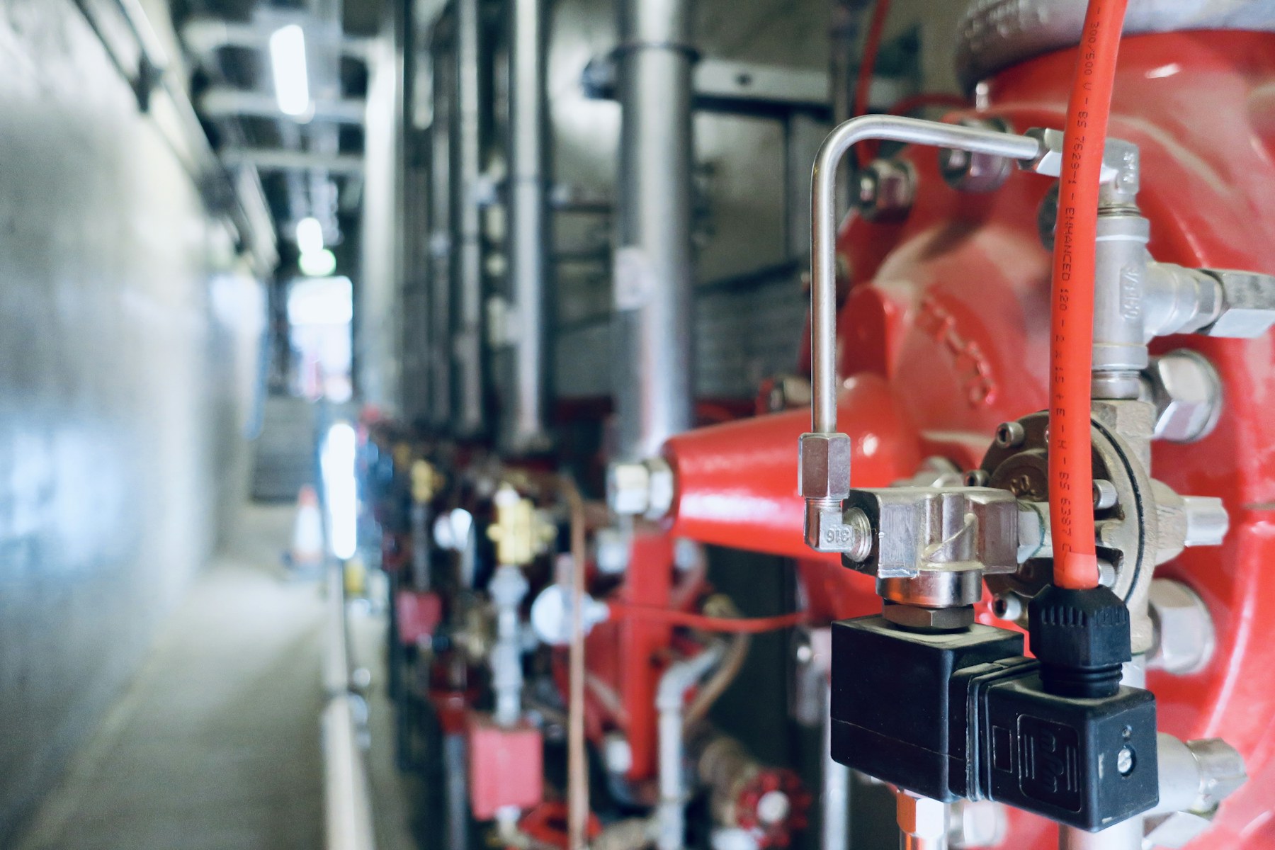 Red industrial fire-system valves and control equipment